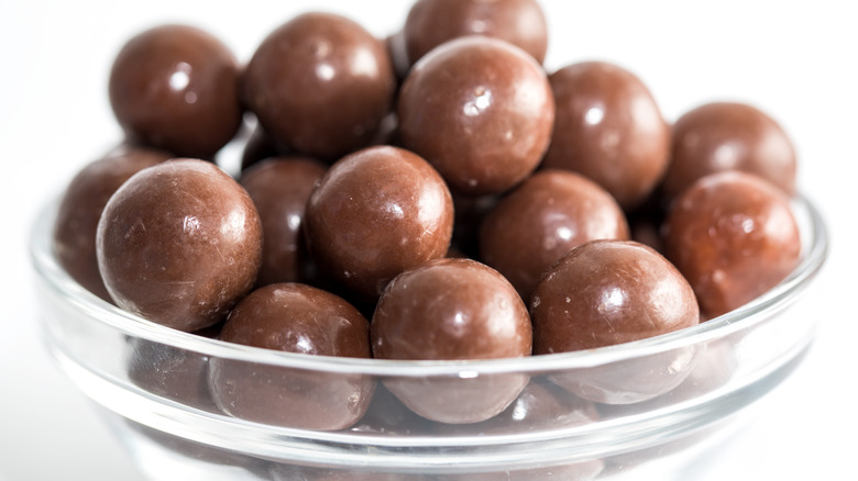 Glass bowl of malted milk balls Whoppers