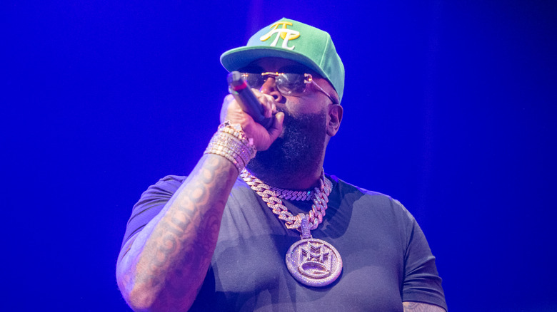 rapper rick ross performing onstage