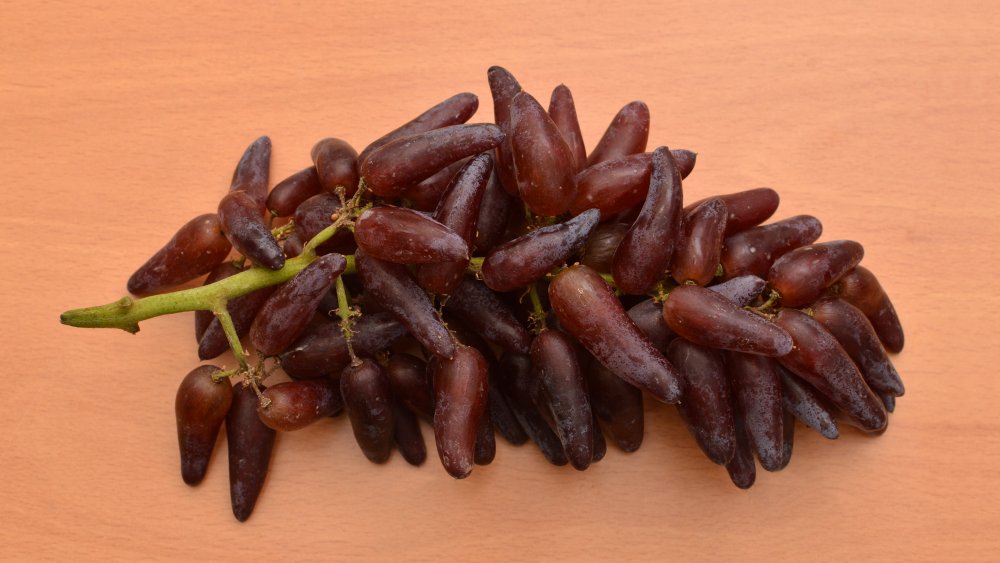 witch finger grapes on table