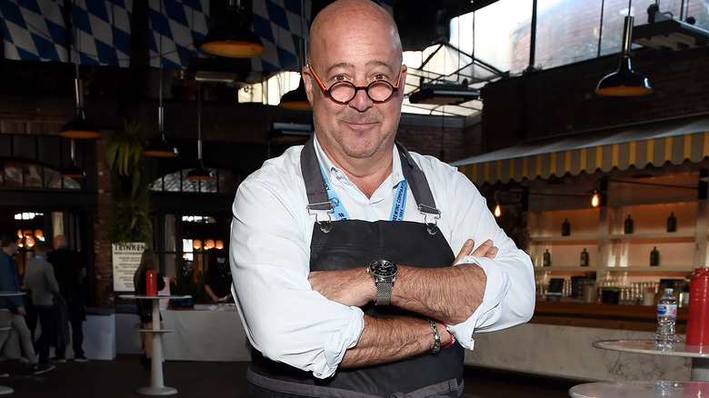 Andrew Zimmern crossing arms