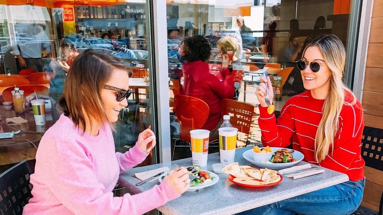 women eating zoes kitchen