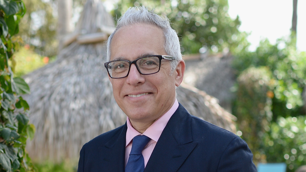 Geoffrey Zakarian smiling, black-framed glasses