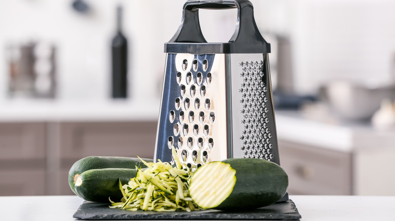 Grated zucchini and grater