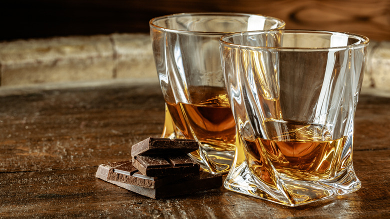 Rum and chocolate on a wooden table