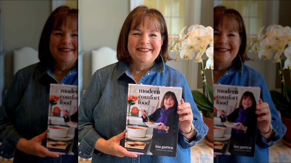 Ina Garten holding her new cookbook