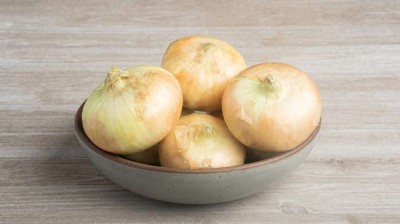 bowl of Vidalia onions on wooden table