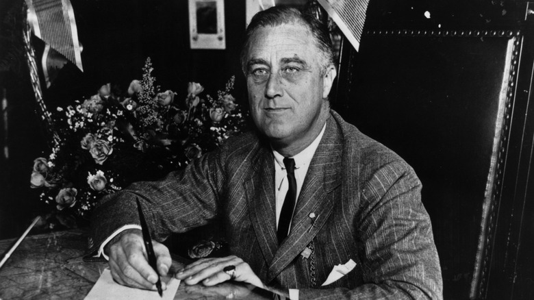 Franklin Roosevelt sitting at a desk