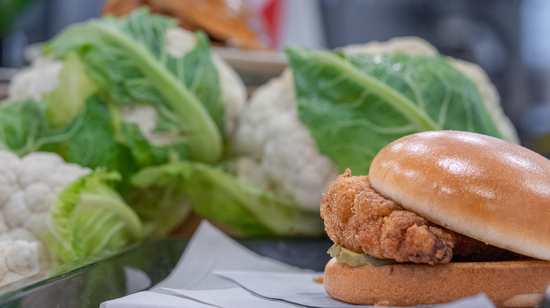 Chick-fil-A cauliflower sandwich with heads of cauliflower