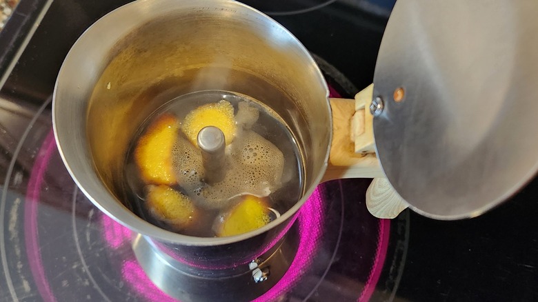 moka pot with lemon peels