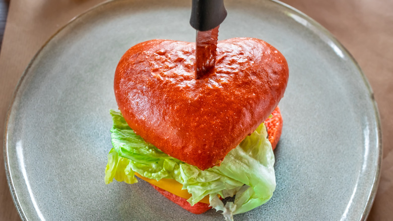 Heart-shaped burger with knife