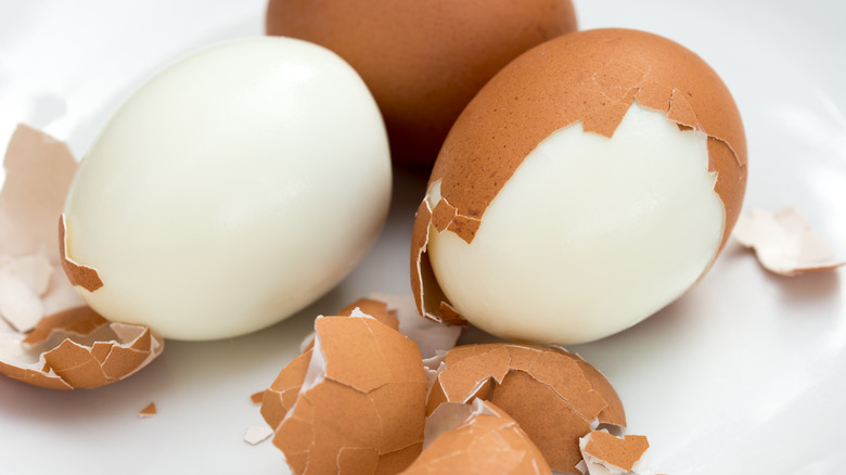 Hard boiled eggs getting peeled