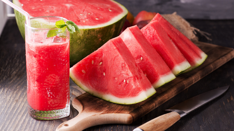 sliced watermelon with a beverage