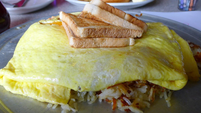 12-egg omelet over hash browns, topped with toast