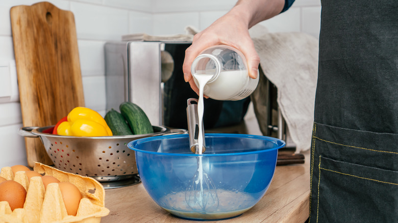 bottle of milk poured into bowl