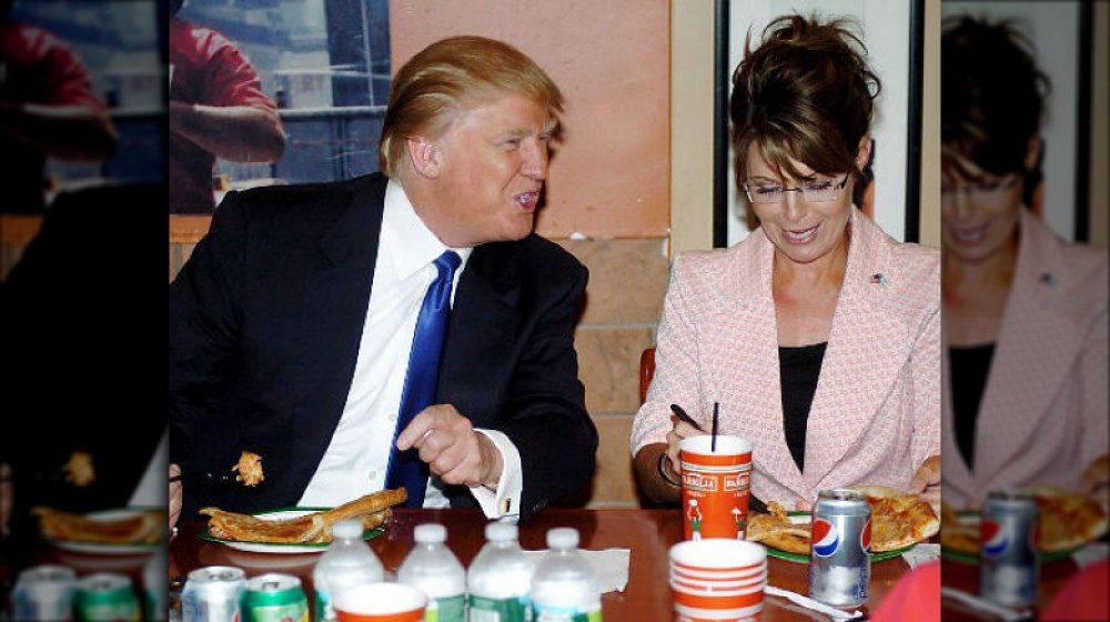 Trump eating pizza with fork