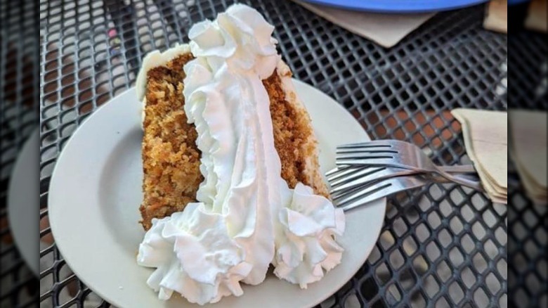 Slice of cake with penis-shaped whipped cream