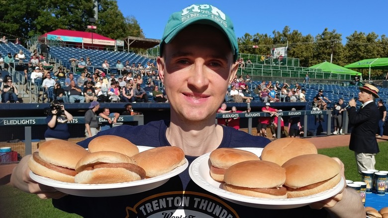 Man holding pork roll sandwiches