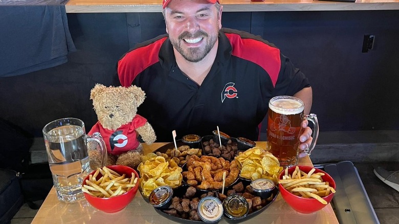 Man posing with food challenge