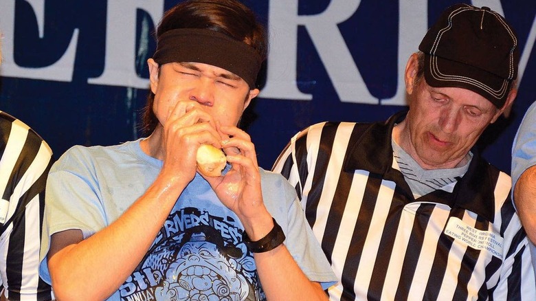 man eating pepperoni rolls 