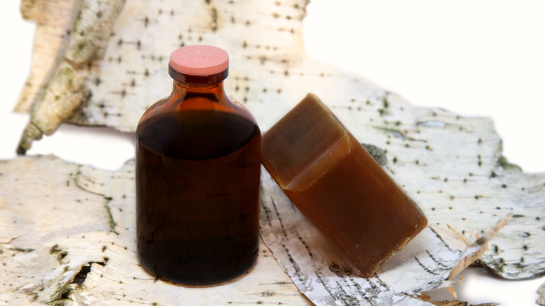 Bottle of tar and bar of soap tar