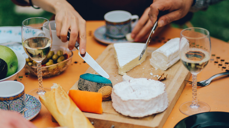 cheese board with bread and white wine