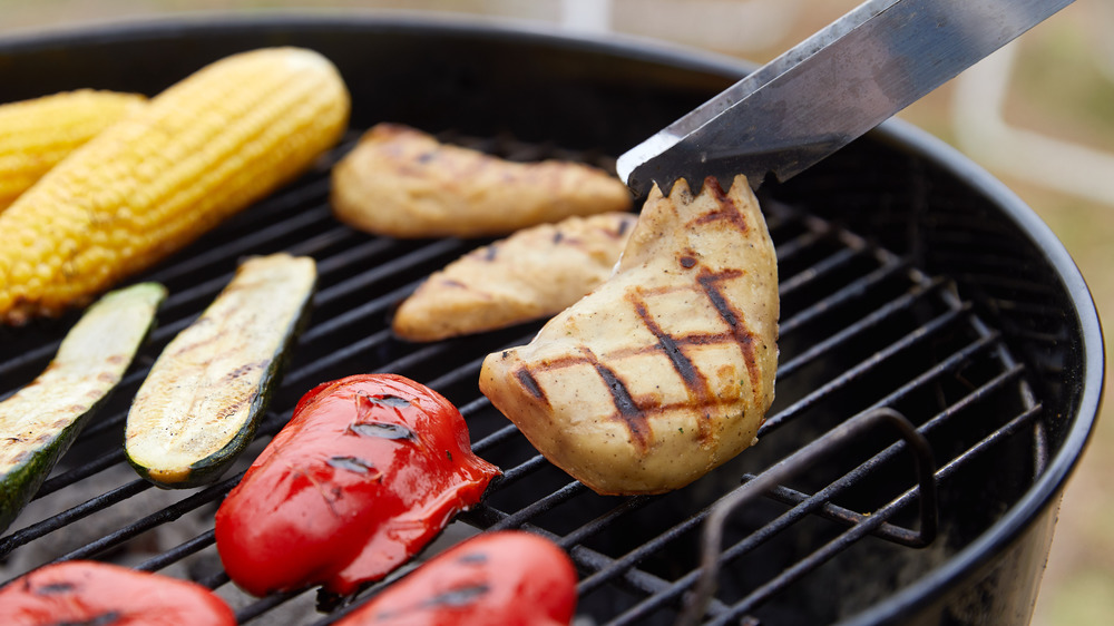 Cultured chicken with char marks on grill