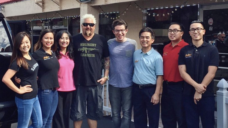 Guy Fieri poses with Saigon Noodle staff