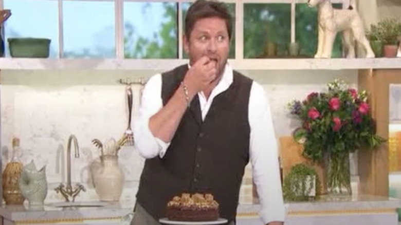 James Martin sampling a cake on British TV