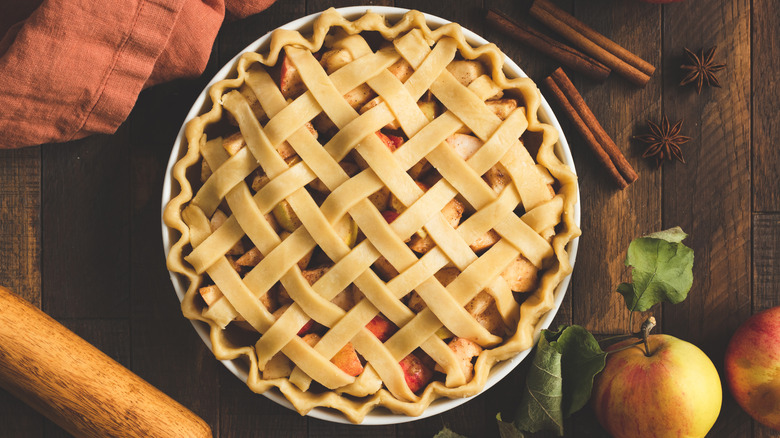 Unbaked apple pie and ingredients