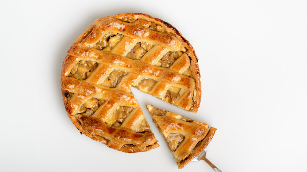 Apple pie with a slice being cut