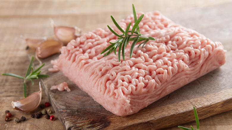 Ground chicken on cutting board