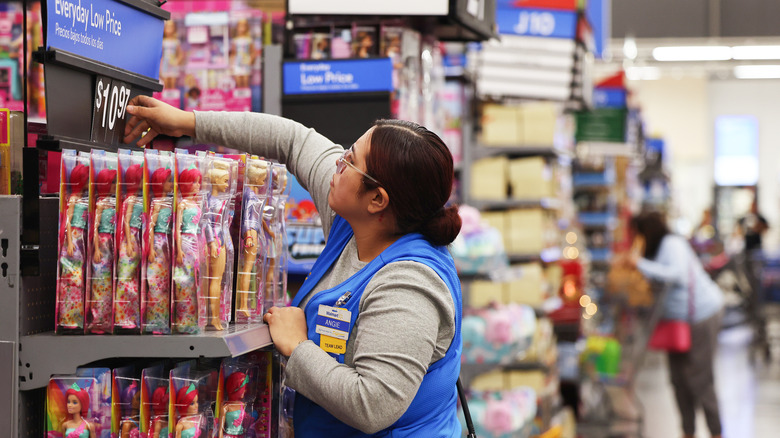 Woman stocking shelves in Walmart