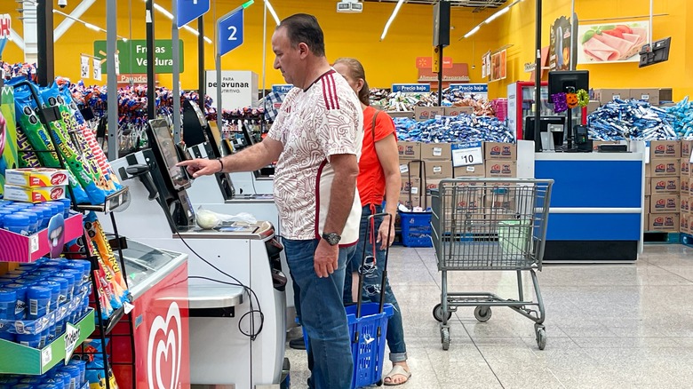 Customers at the Walmart self-checkout