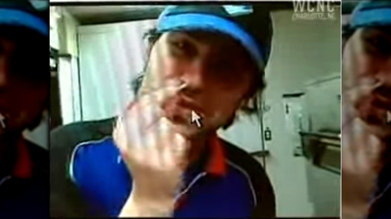 domino's employee sticking cheese up his nose