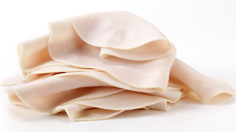 Piled slices of deli turkey meat