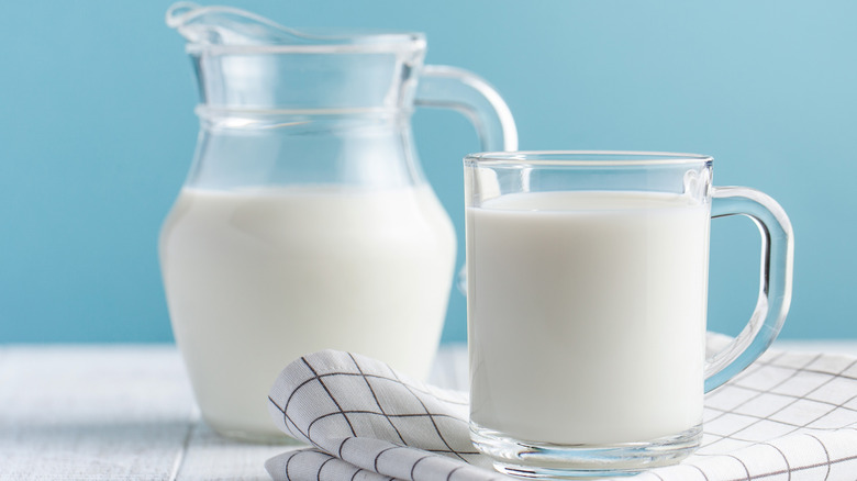 Glass and jug filled with milk