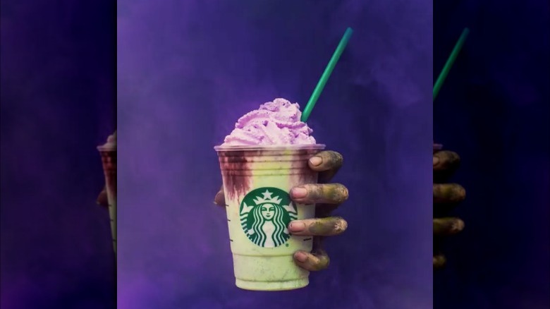 Hand holding a Starbucks Zombie Frappuccino