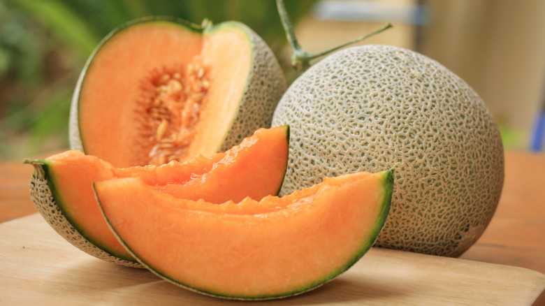 cantaloupes on wooden surface