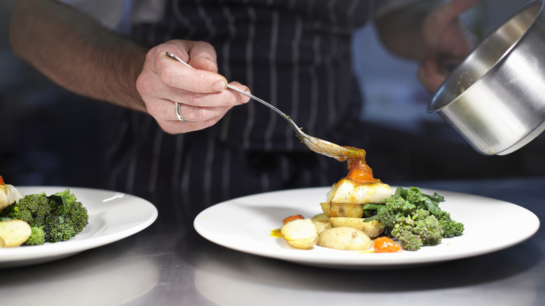 Chef plating up food