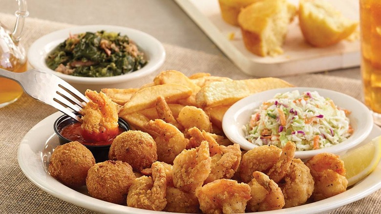 fried shrimp, hush puppies, cocktail sauce, slaw, potato wedges, cornbread muffin, turnip greens