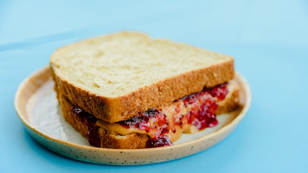 Peanut butter and jelly sandwich on a plate