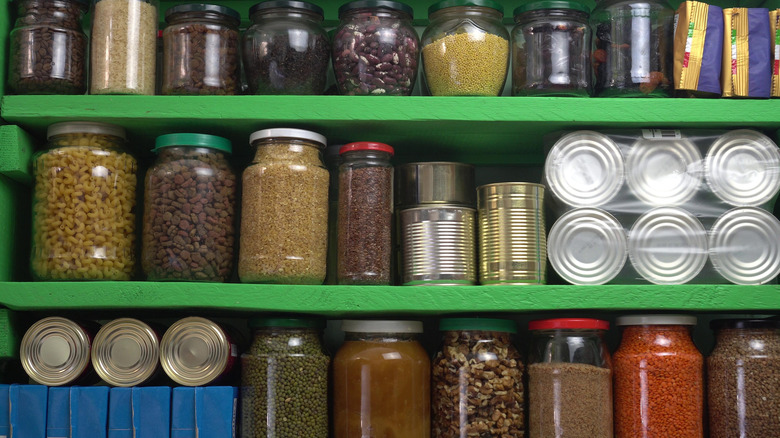 A pantry with cans and jars