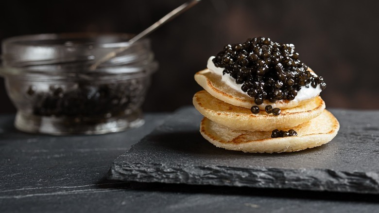 fish caviar on pancakes