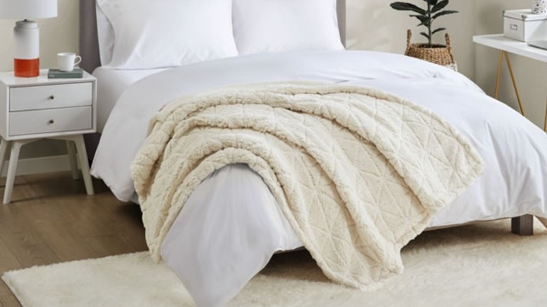 Bed with Aldi Sherpa throw