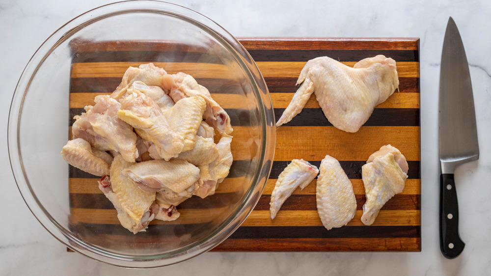 baked chicken wings being prepared