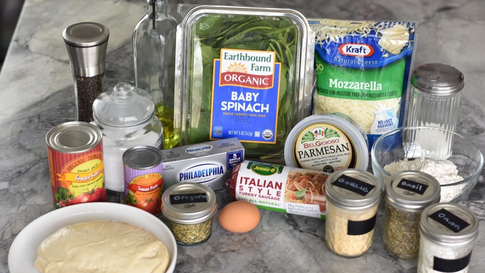 Ingredients to make calzones and dipping sauce