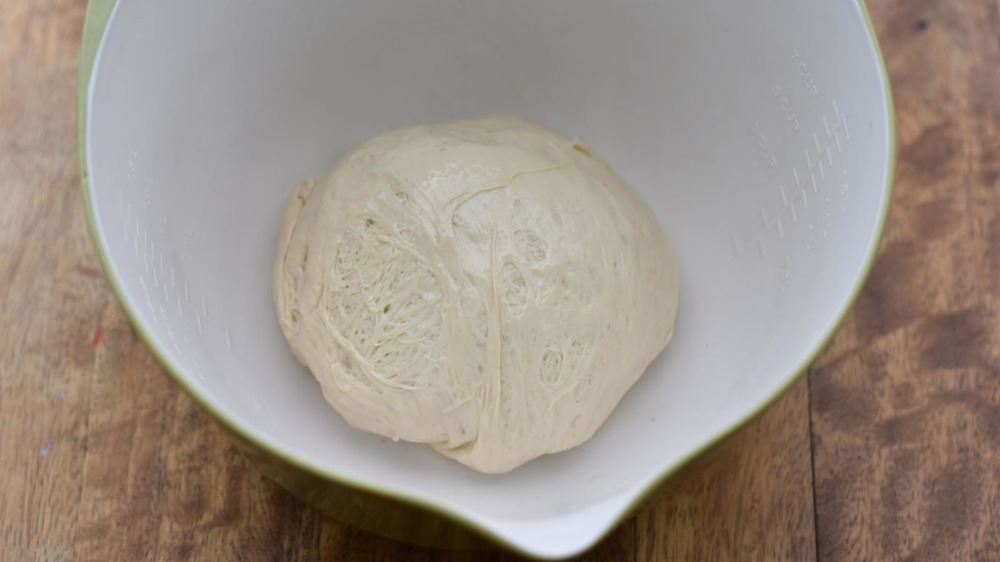 Pizza dough in a bowl ready to rise