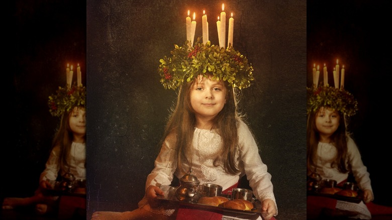 Girl in Lucia crown with lussekatter