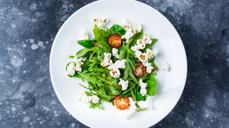 salad with tomatoes and popcorn