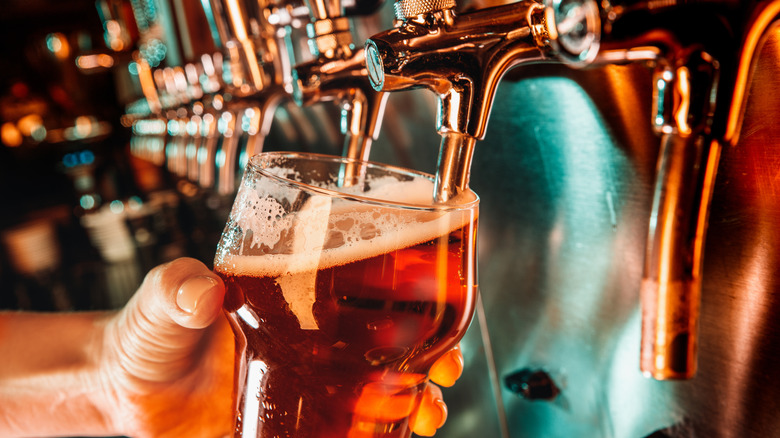 A bartender pouring beer